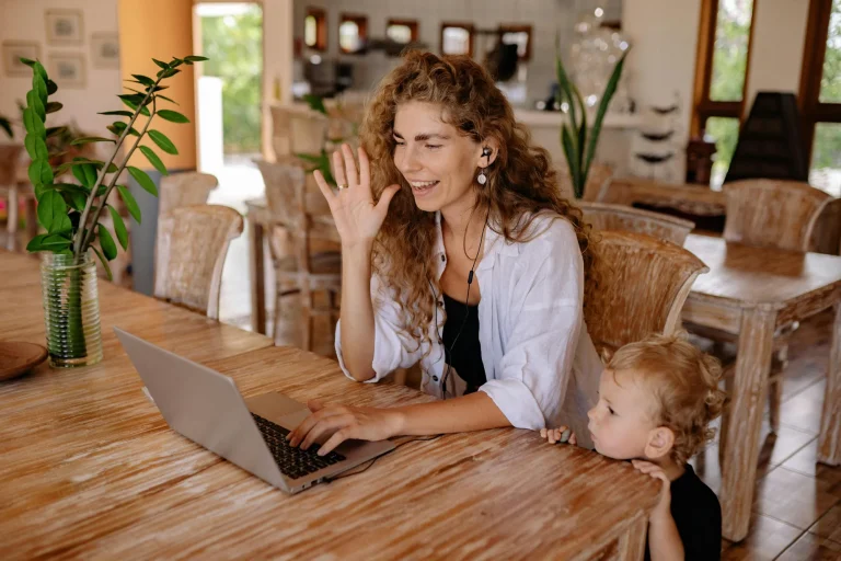 woman having a zoom meeting with a client in her home