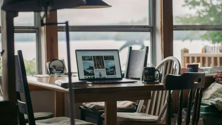 laptop in a window overlooking the water