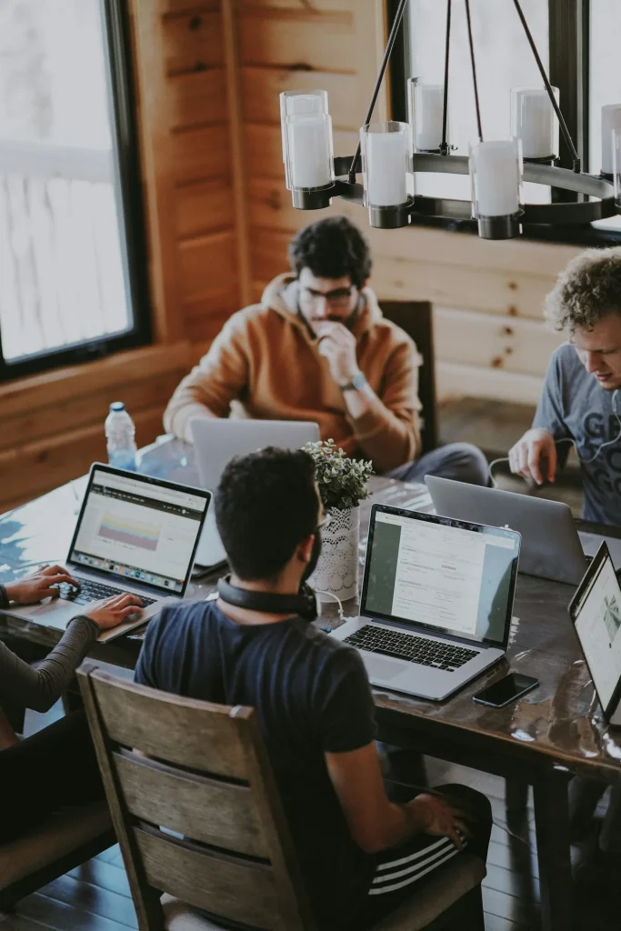 people working together on laptops