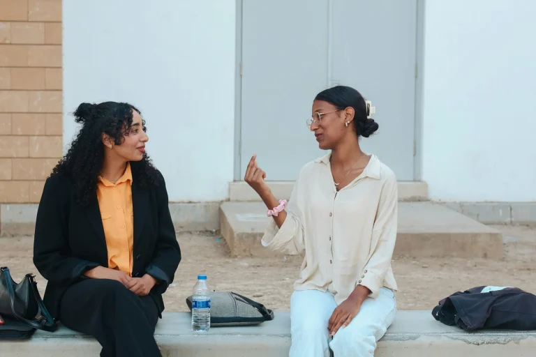 two women conversing