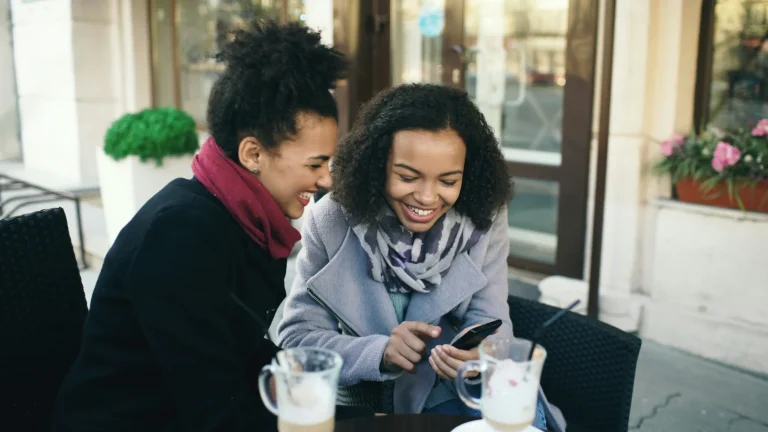 two women having a meeting over coffee
