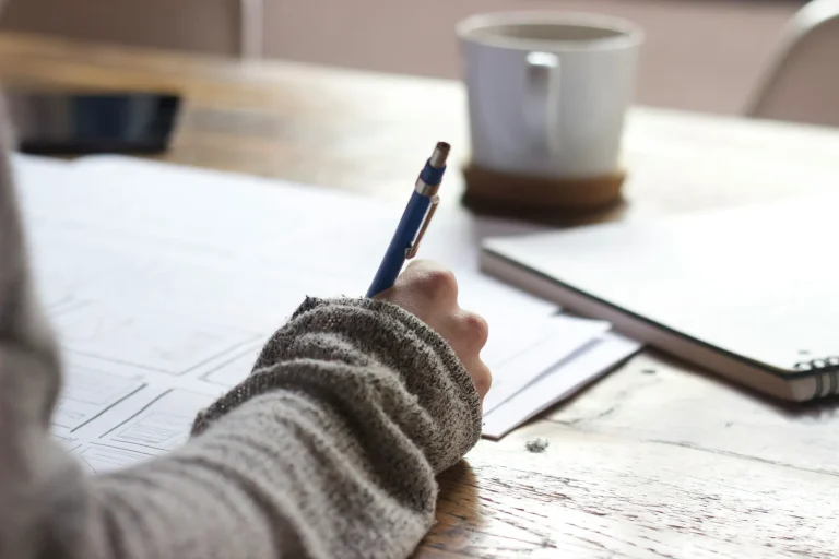 person writing an exam